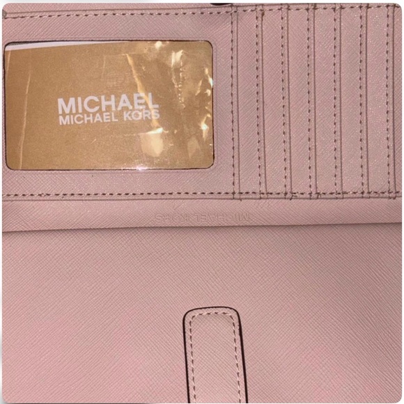 Michael Kors light pink wrislet.